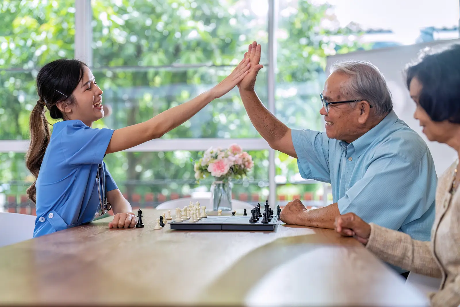 A support worker and an older man in his own home